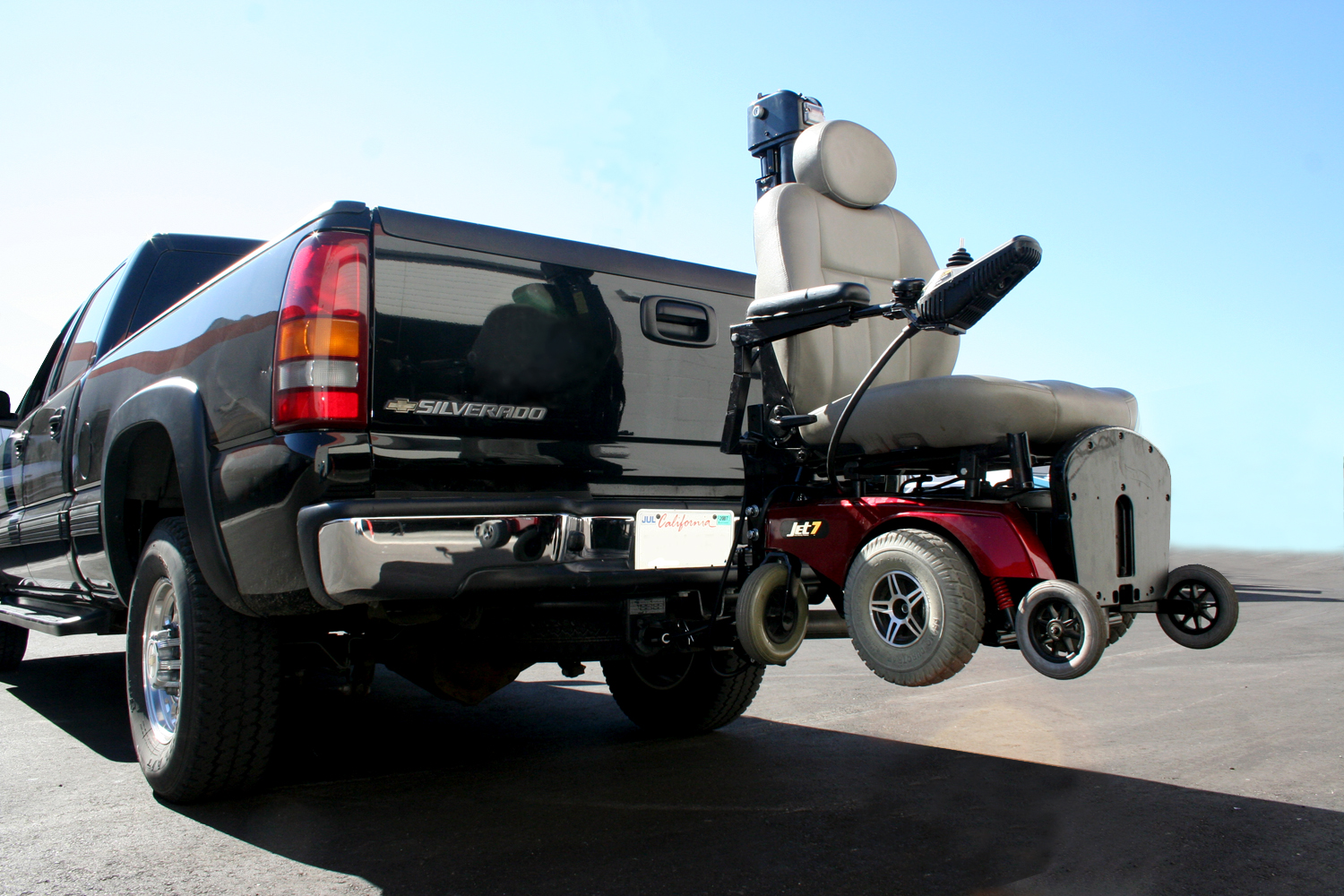 Power wheelchair being transported with a vehicle wheelchair lift